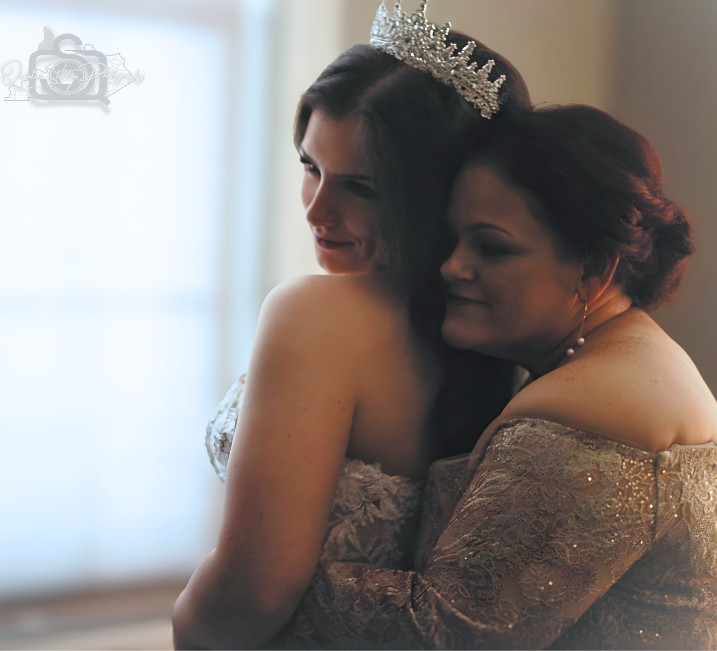 Emotional wedding photography of bride & mother embracing, showcasing family bond on her special day.