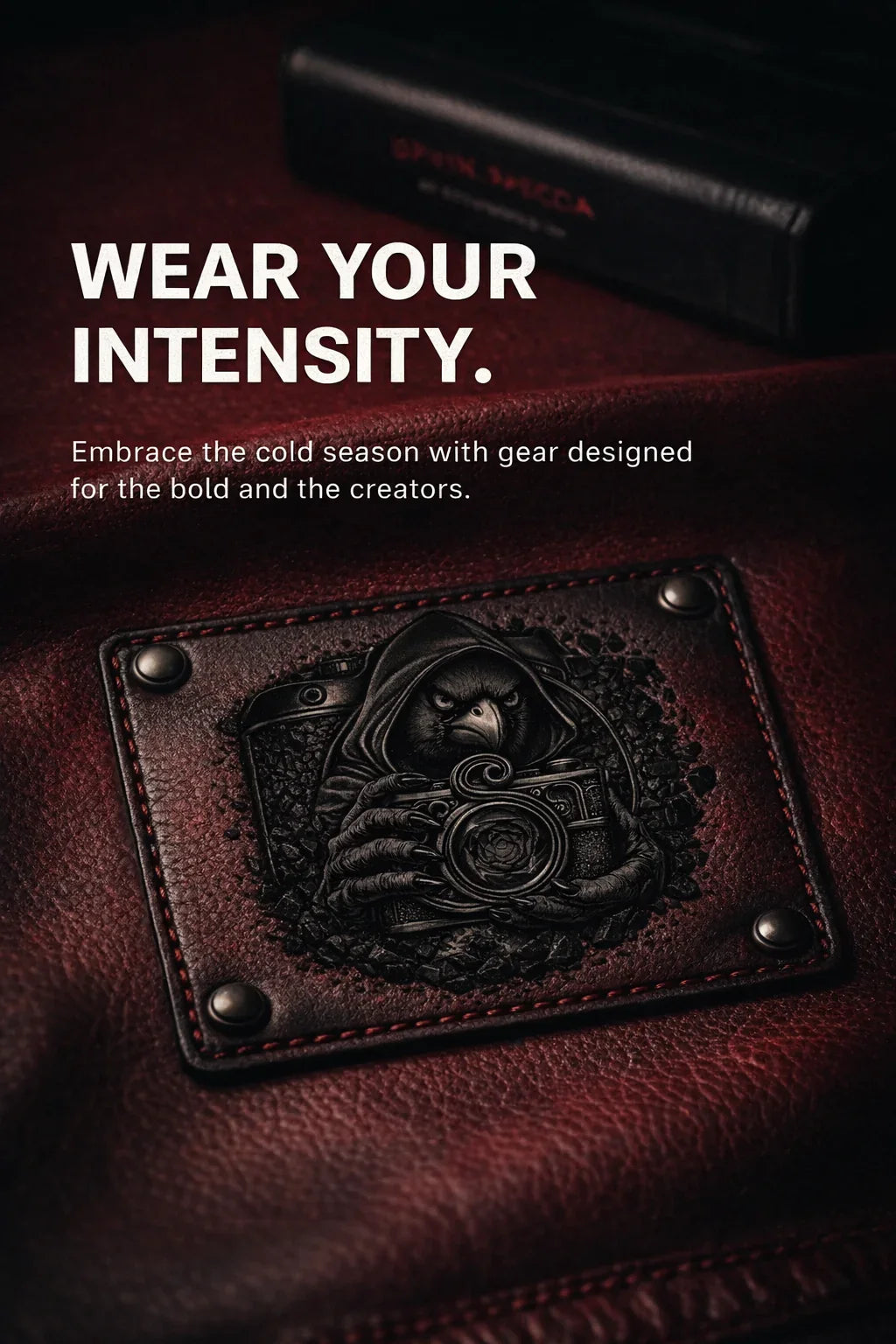 Quinton Stocton Photography branded leather patch with hooded bird camera design and bold text on dark red leather.