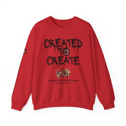 Red sweatshirt with 'Created to Create' text and logo on a white background