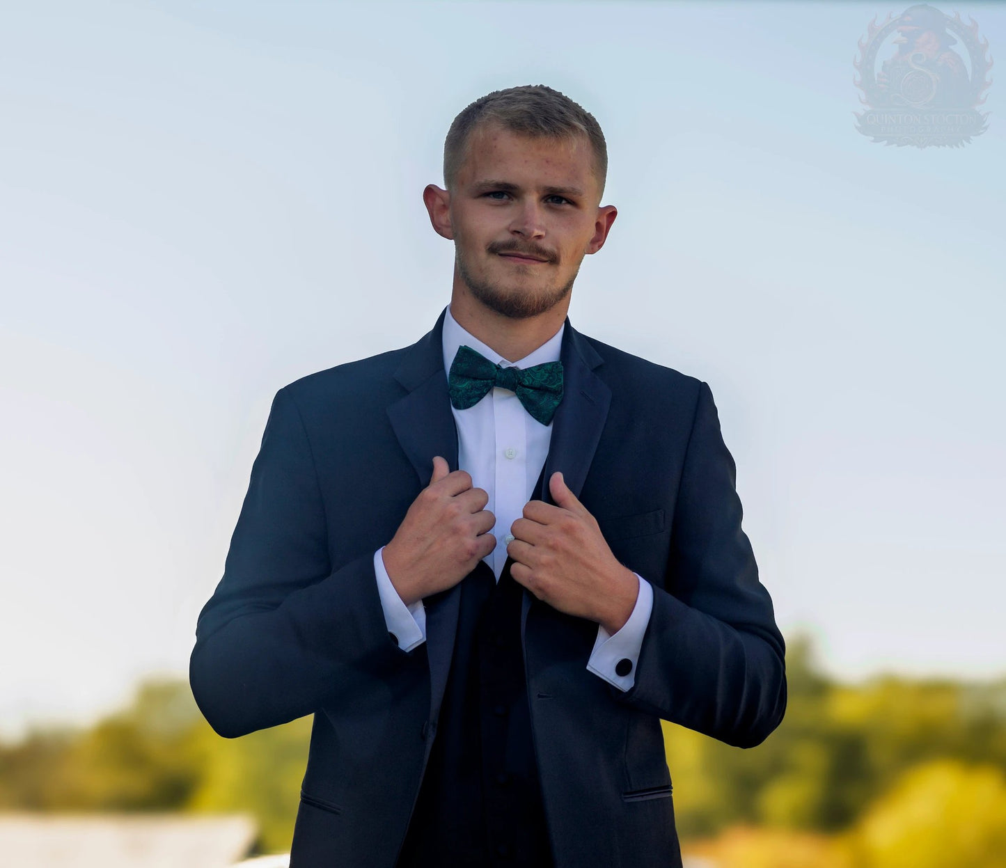 Groom in navy suit and green bow tie, Kentucky wedding coverage by Quinton Stocton Photography.