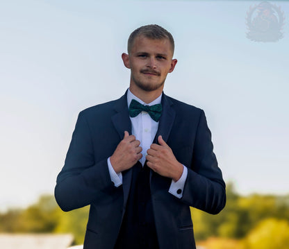 Groom in navy suit and green bow tie, Kentucky wedding coverage by Quinton Stocton Photography.