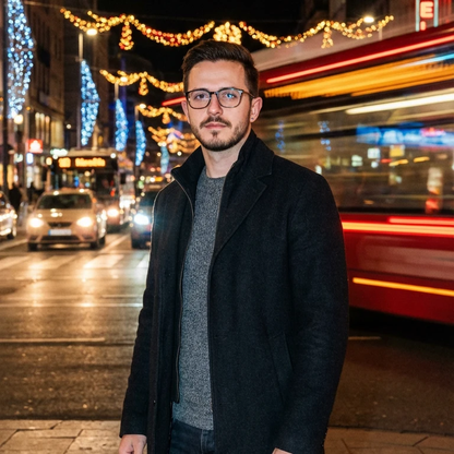 Quinton Stocton Photography portrait session on a night-lit city street with a man in glasses.
