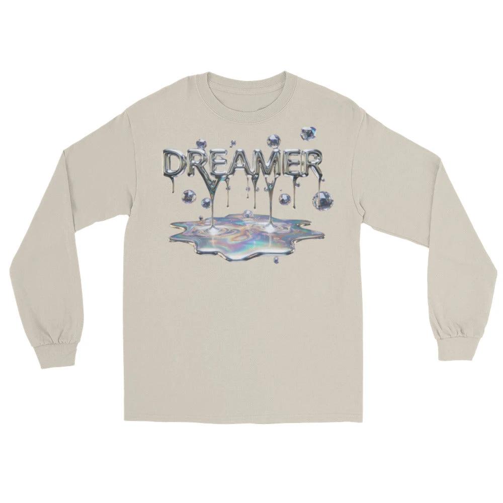 Dreamer Mind Cinematic Long Sleeve tee with dripping chrome 'DREAMER' over a holographic puddle on beige fabric.